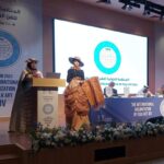 Amanah Asri Ketua Komisi Ilmu Pengetahuan dan Penelitian Sedang Presentasi di kegiatan Konferensi Internasional (World General Assembly) International Organisation for Art and Culture (IOV)